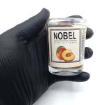 550048 شمع معطر شیشه ای نوبل مدل هلو ( پچ )